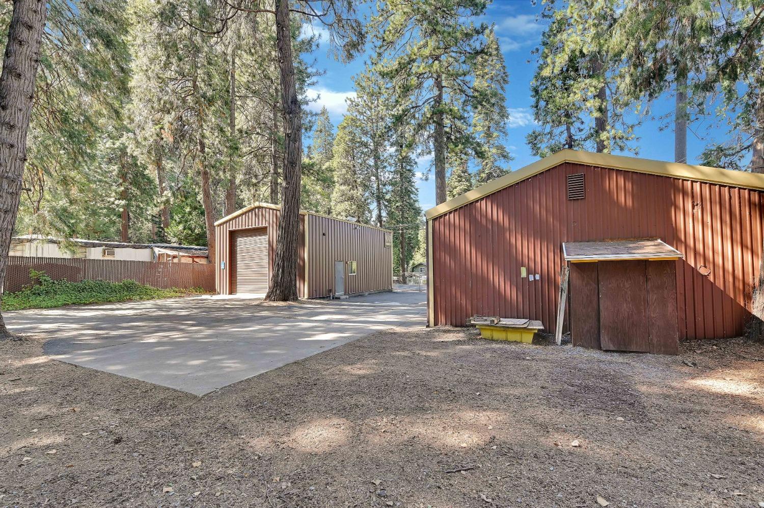 6016 Pony Express Trail Pollock Pines, CA 95726 - Photo 48 of 53 a house with trees in front of it
