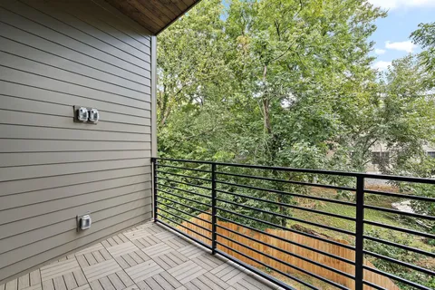 a view of a balcony with a bench