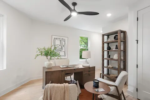 a workspace with furniture and window