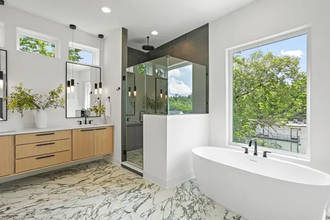 a bathroom with a bathtub and a sink