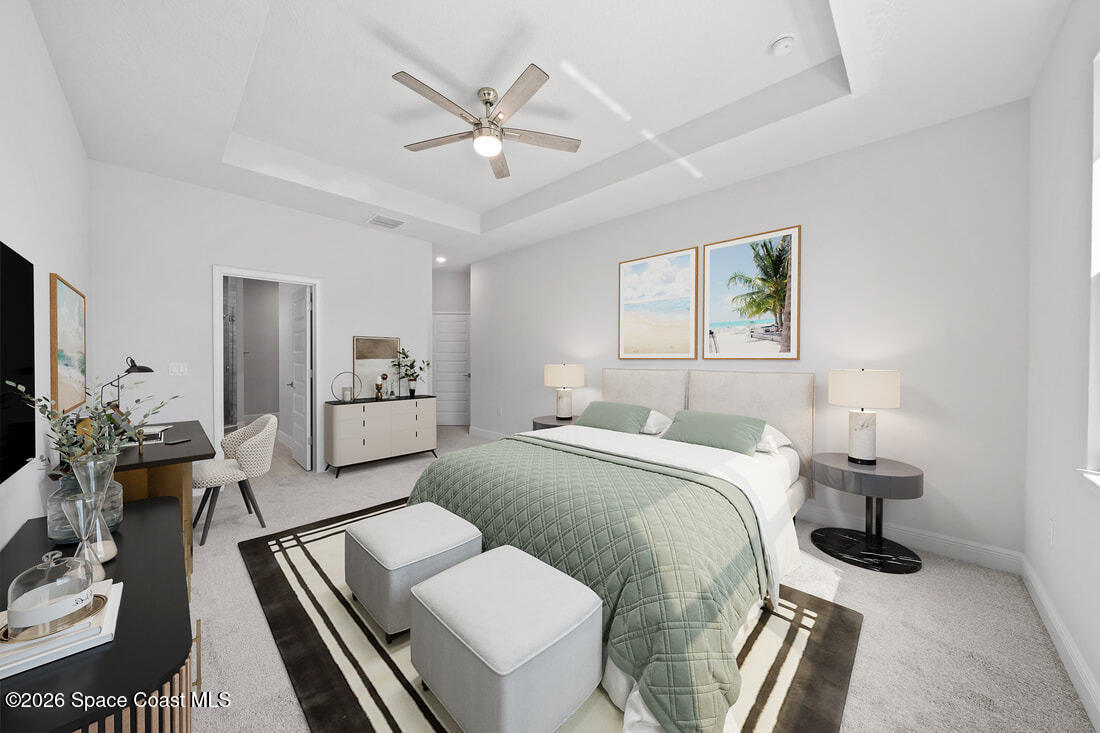 356 Altman Avenue Southeast Palm Bay, FL 32909 - Photo 5 of 27 a spacious bedroom with a bed and a chandelier