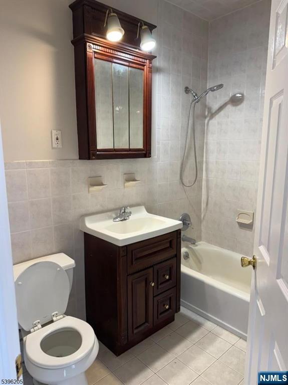 507 Bloomfield Avenue, Unit 2 Nutley, NJ 07110 - Photo 3 of 9 a bathroom with a sink vanity mirror and toilet