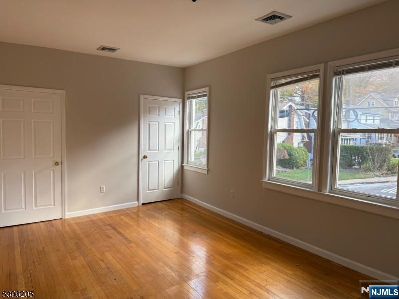 507 Bloomfield Avenue, Unit 2 Nutley, NJ 07110 - Photo 4 of 9 a view of an empty room with a window