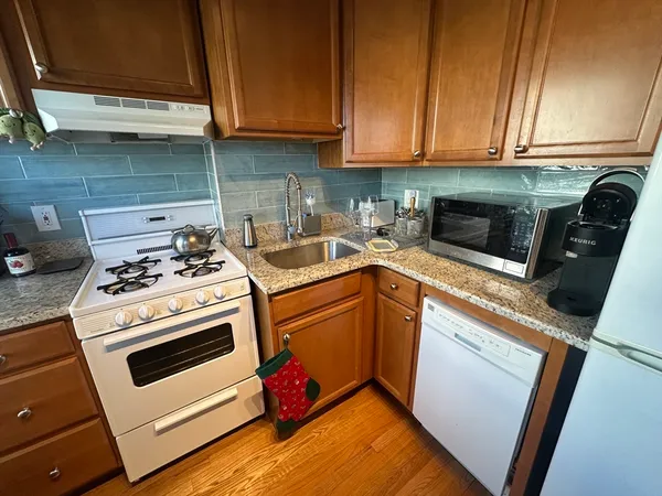 a kitchen with a stove and a microwave