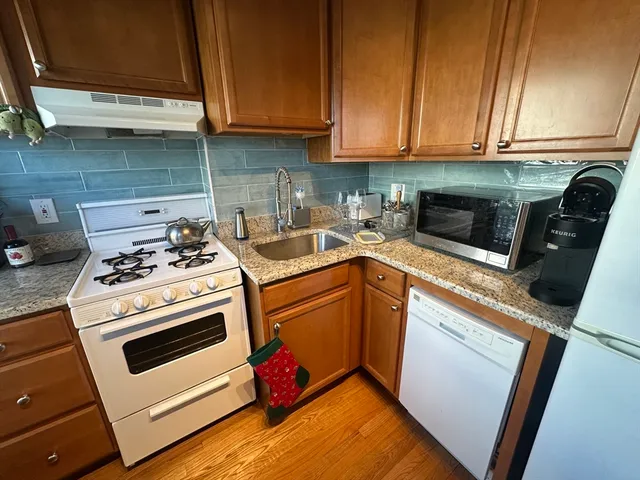 a kitchen with a stove and a microwave