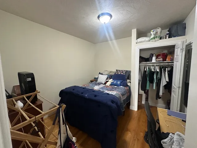 a bed room with a bed and a television