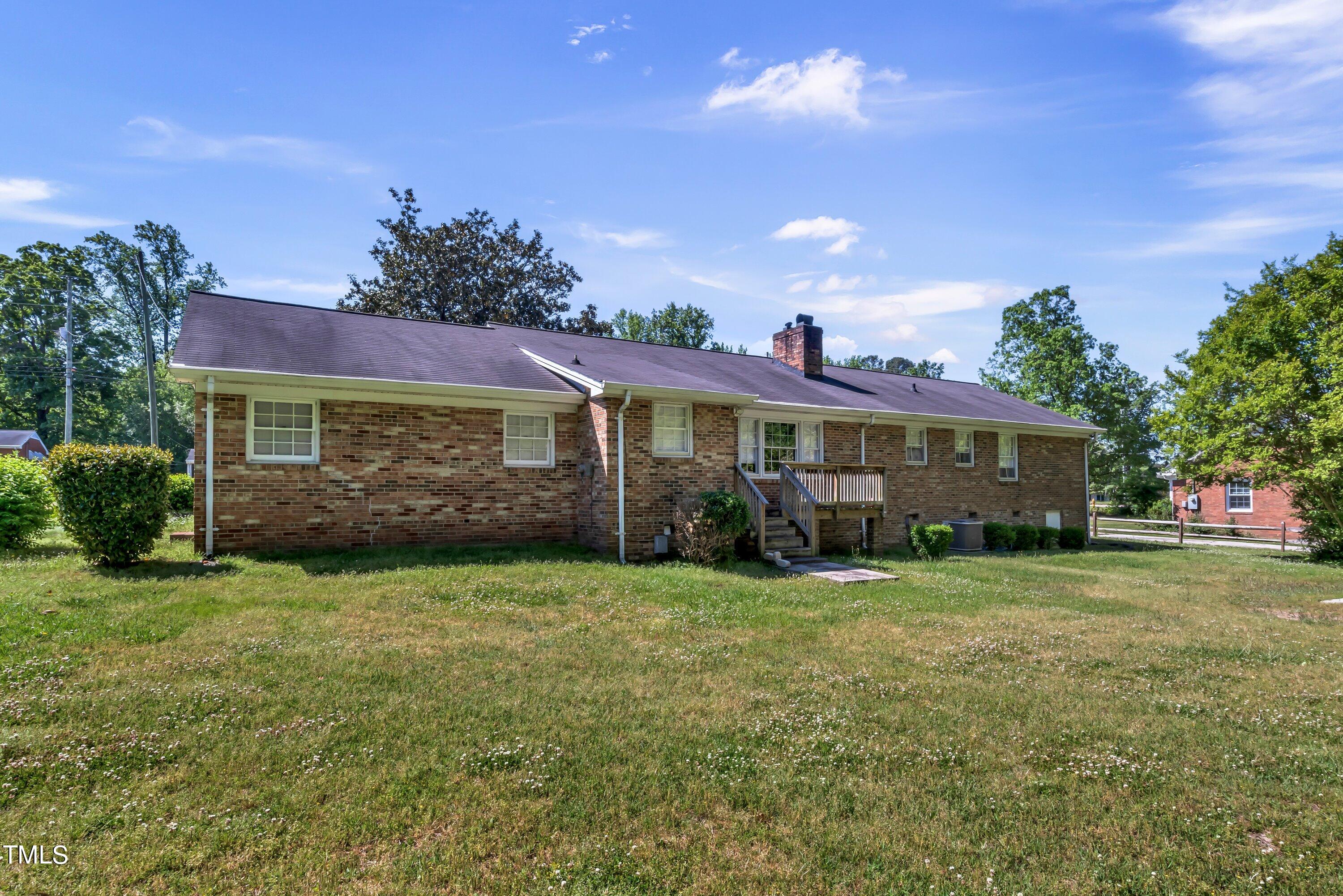3833 Buffaloe Road Raleigh, NC 27604 - Photo 18 of 25 a front view of a house with a yard