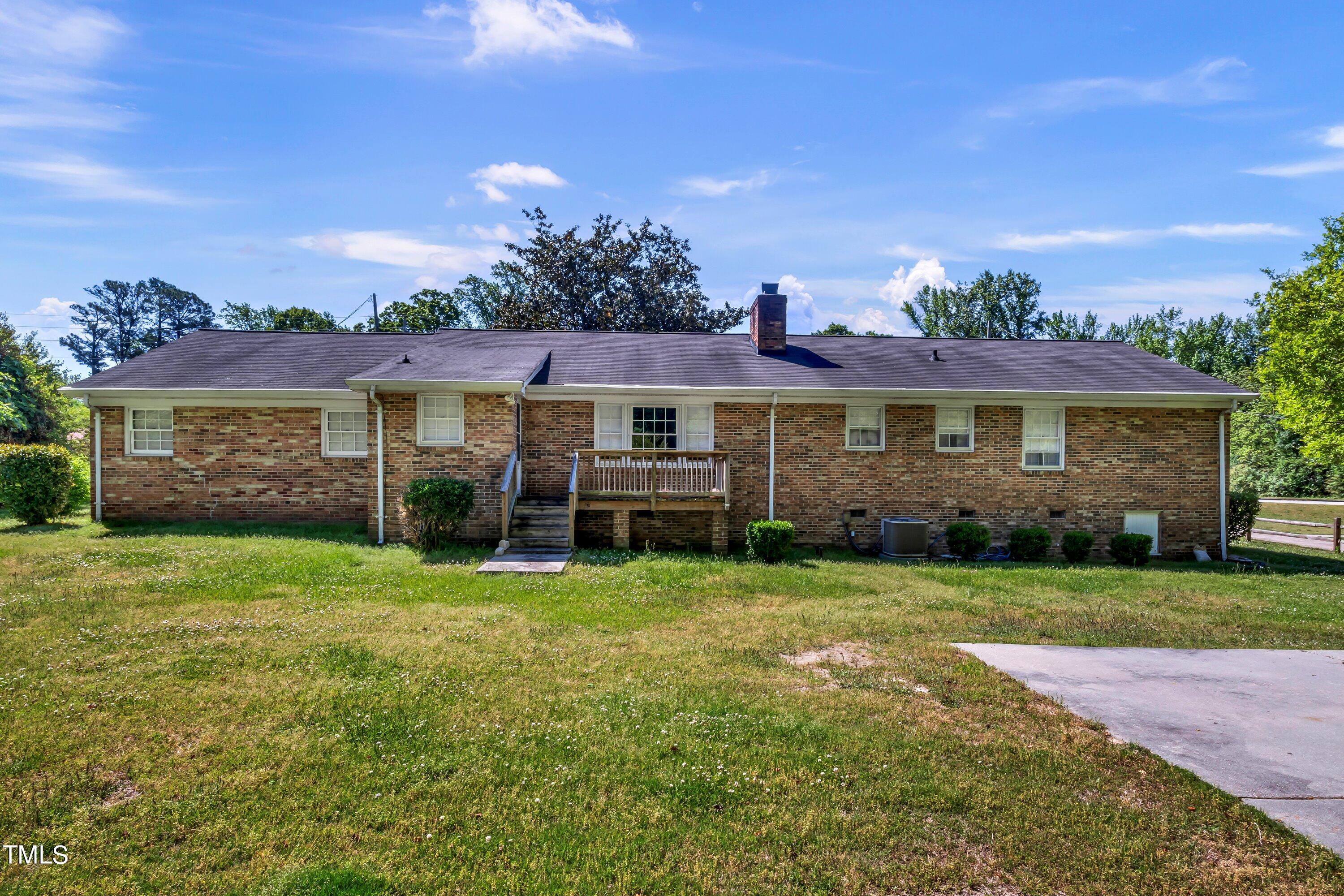 3833 Buffaloe Road Raleigh, NC 27604 - Photo 20 of 25 a view of a house with a yard
