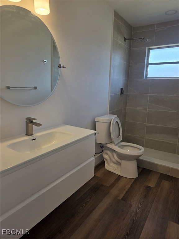 2271 Alton Road Port Charlotte, FL 33952 - Photo 8 of 9 a bathroom with a toilet a sink and mirror
