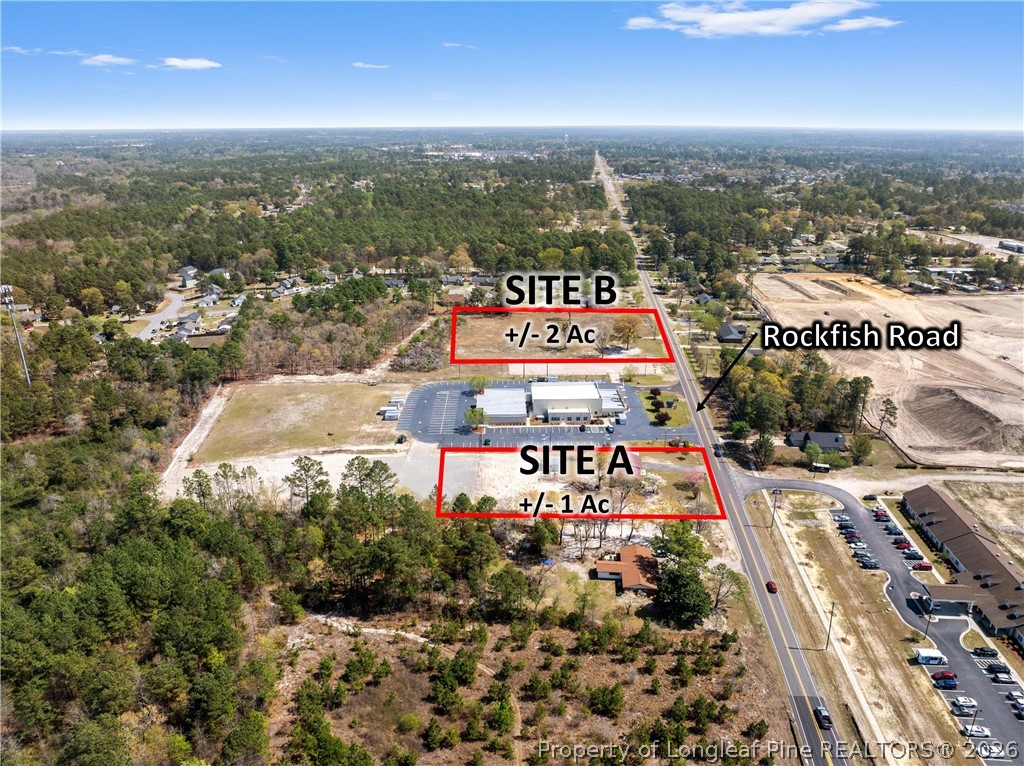 7050 Rockfish Road Fayetteville, NC 28306 - Photo 1 of 9 an aerial view of a city