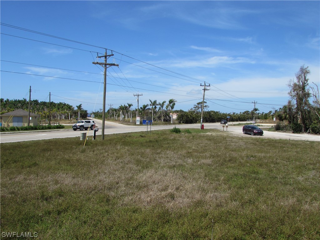 13350 Stringfellow Road Bokeelia, FL 33922 - Photo 13 of 46 a view of a garden with lawn chairs