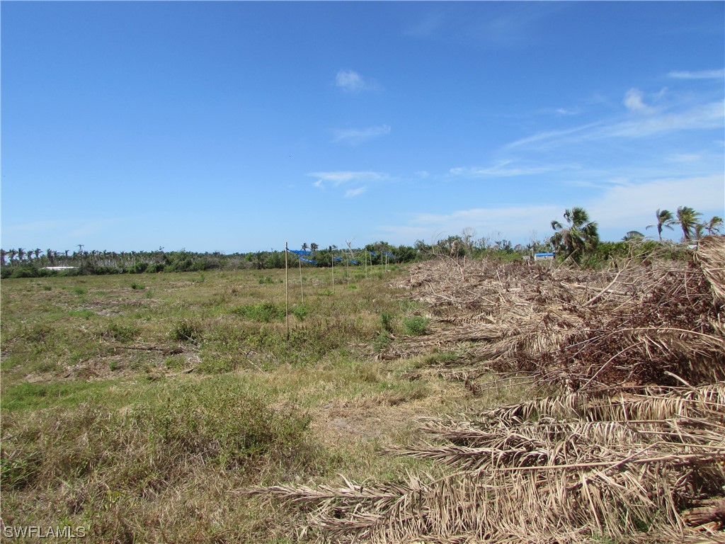 13350 Stringfellow Road Bokeelia, FL 33922 - Photo 16 of 46 a view of a lake with sunset in background