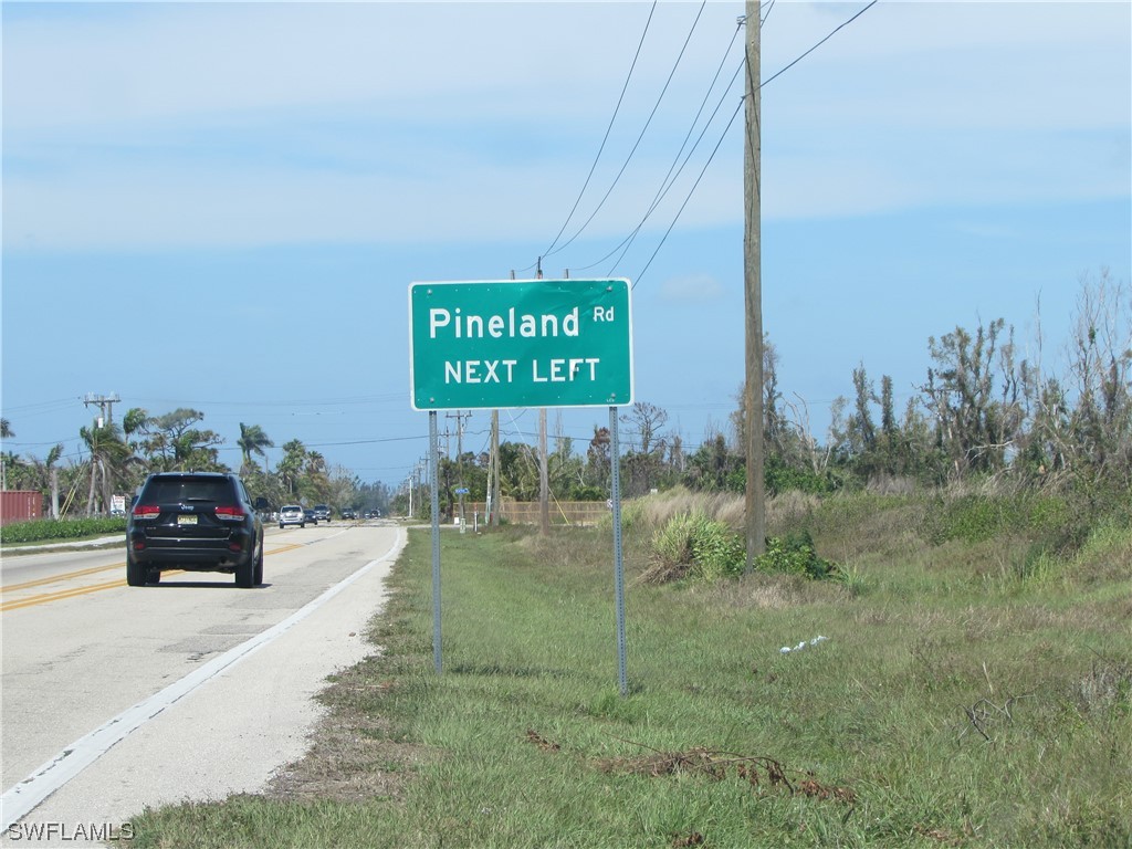 13350 Stringfellow Road Bokeelia, FL 33922 - Photo 2 of 46 a view of a street with cars parked on road