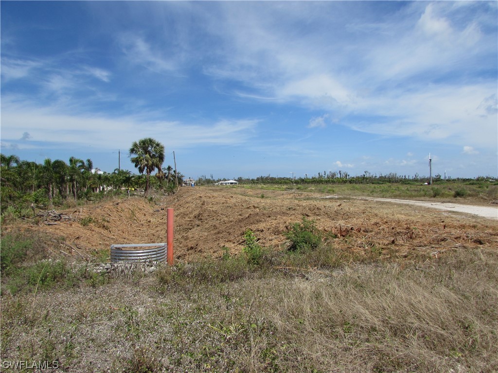 13350 Stringfellow Road Bokeelia, FL 33922 - Photo 21 of 46 a view of a beach with a field