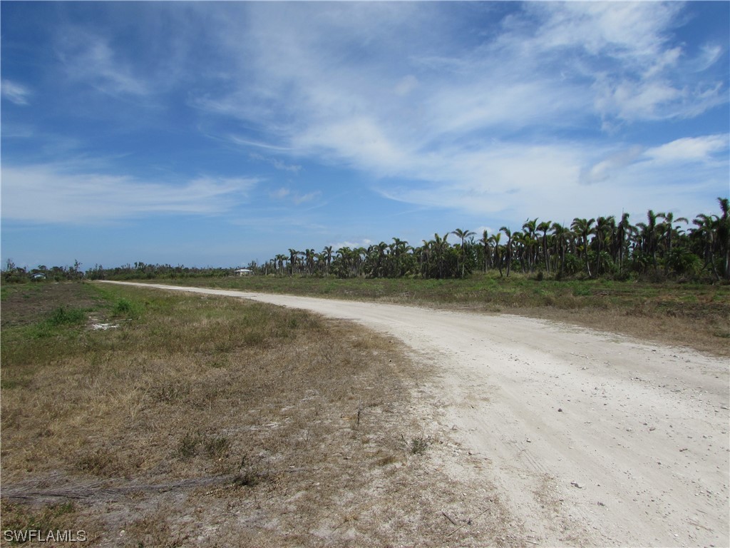 13350 Stringfellow Road Bokeelia, FL 33922 - Photo 27 of 46 a view of a lake with houses in the back