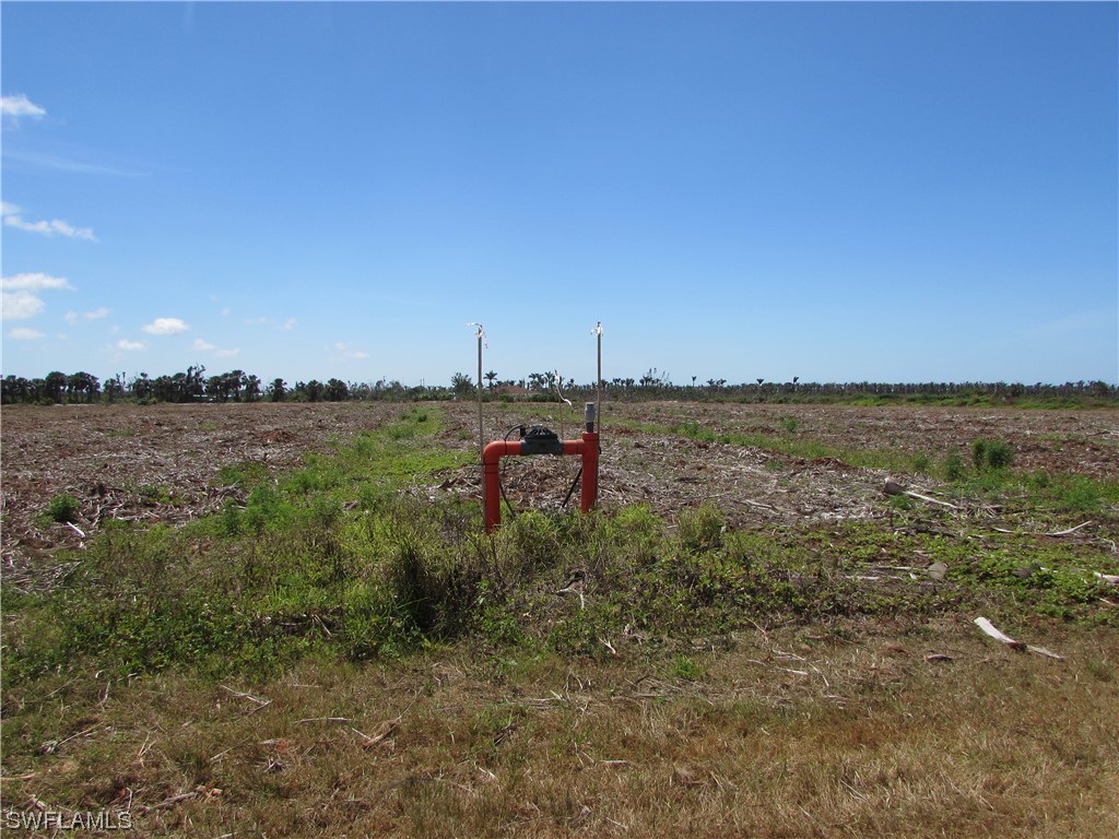 13350 Stringfellow Road Bokeelia, FL 33922 - Photo 33 of 46 a view of a lake with houses in the back