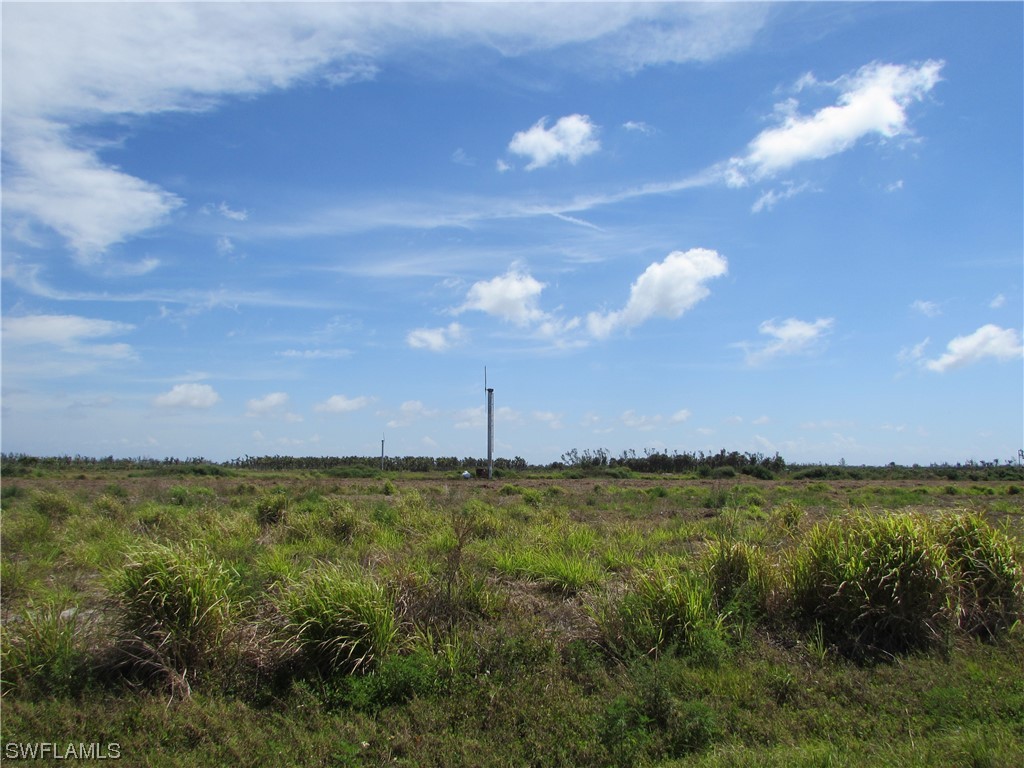 13350 Stringfellow Road Bokeelia, FL 33922 - Photo 34 of 46 a view of a lake and sunset