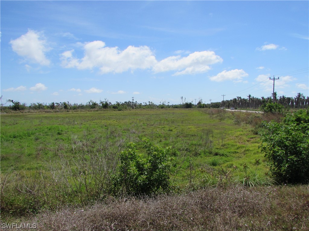 13350 Stringfellow Road Bokeelia, FL 33922 - Photo 10 of 46 a view of a lake with a big yard
