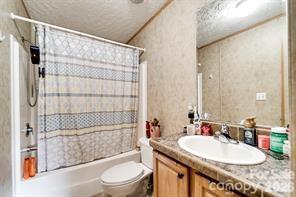 179 Fresh Water Rdg Road Whittier, NC 28789 - Photo 27 of 48 a bathroom with a sink toilet and shower