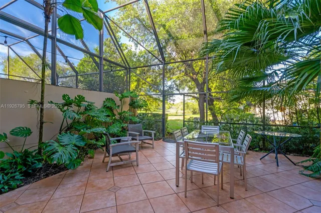 a backyard of a house with outdoor seating