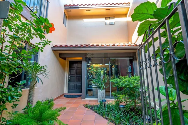 a view of a potted plants in front of a house