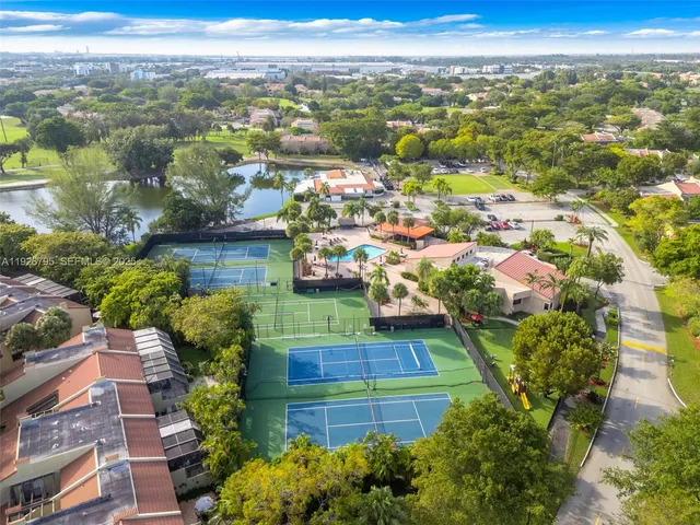 an aerial view of a house with a swimming pool