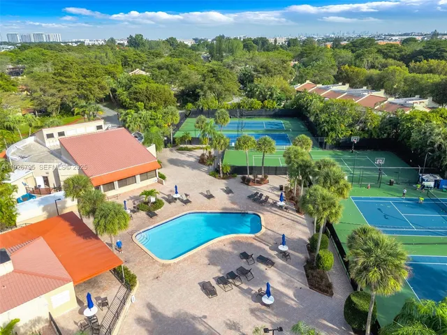 an aerial view of residential houses with outdoor space