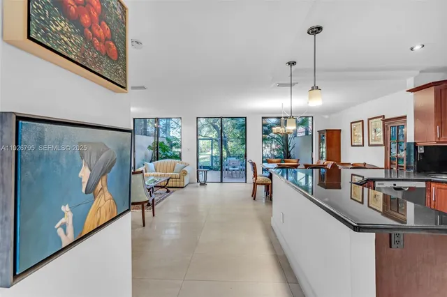 a large room with furniture and a flat screen tv