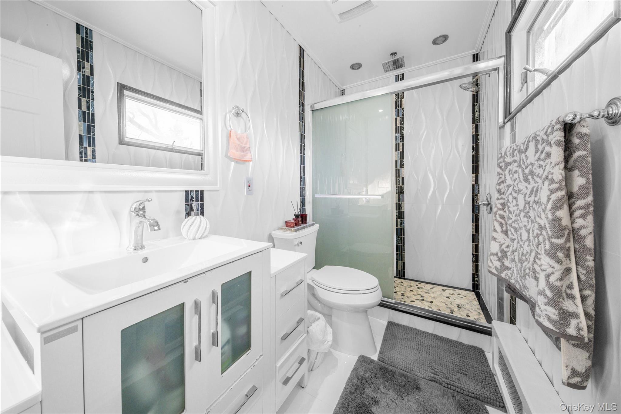 166-02 76th Avenue Queens, NY 11366 - Photo 18 of 28 a bathroom with a sink toilet and shower