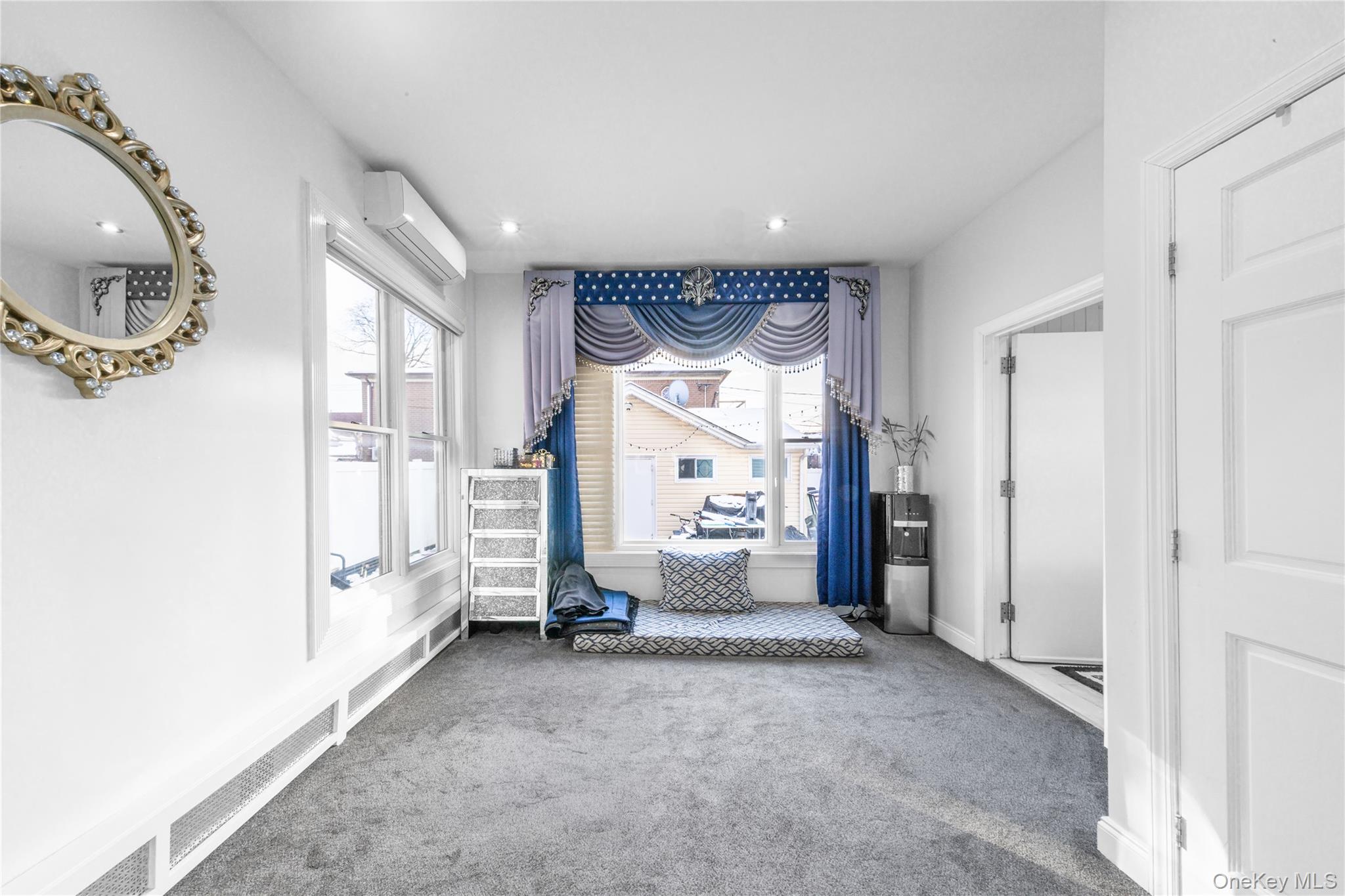 166-02 76th Avenue Queens, NY 11366 - Photo 19 of 28 a view of a big room with entryway bedroom and hall with wooden floor