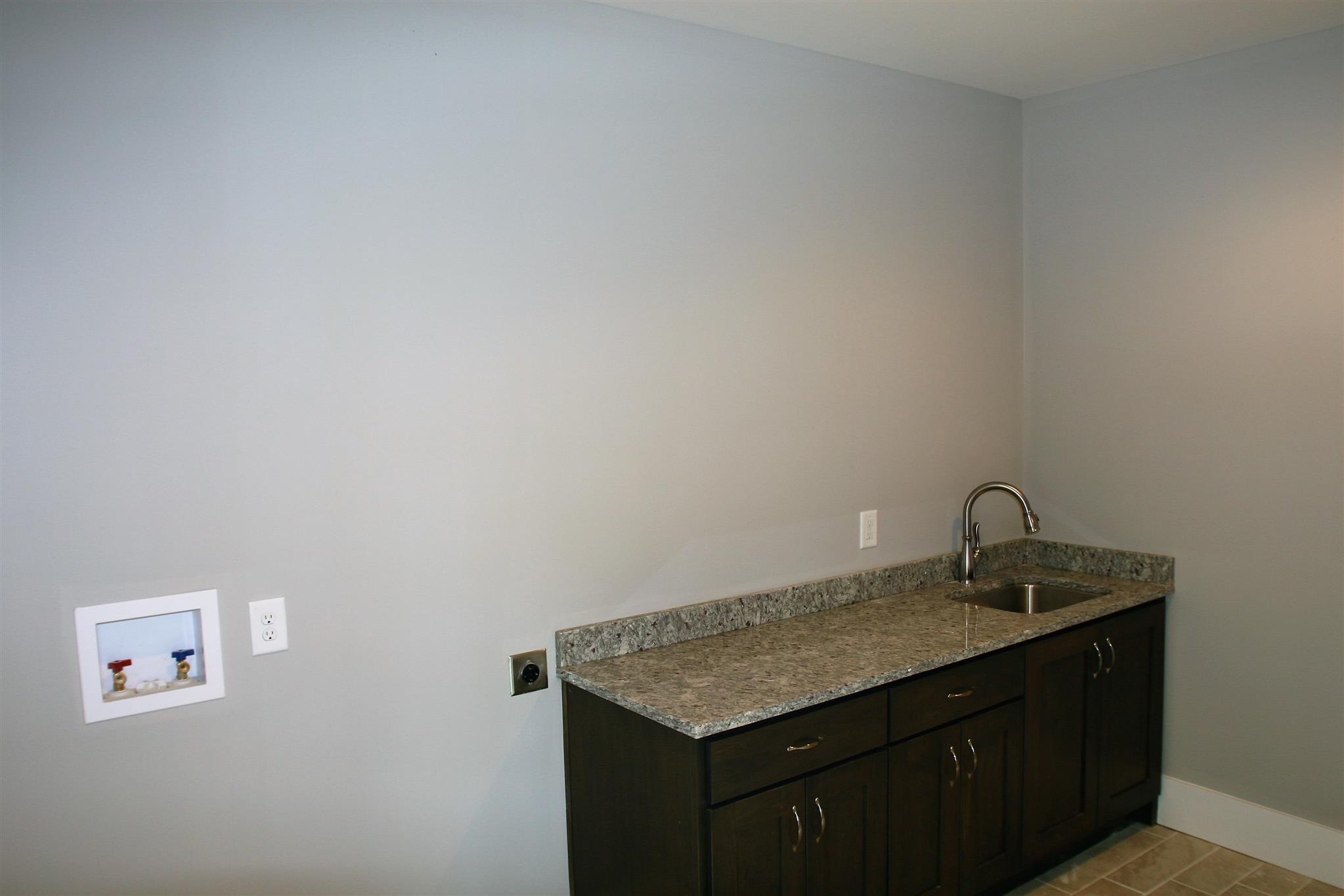8191 Bethlehem Road Springfield, TN 37172 - Photo 11 of 25 Large Laundry Room with cabinetry, Granite and a sink