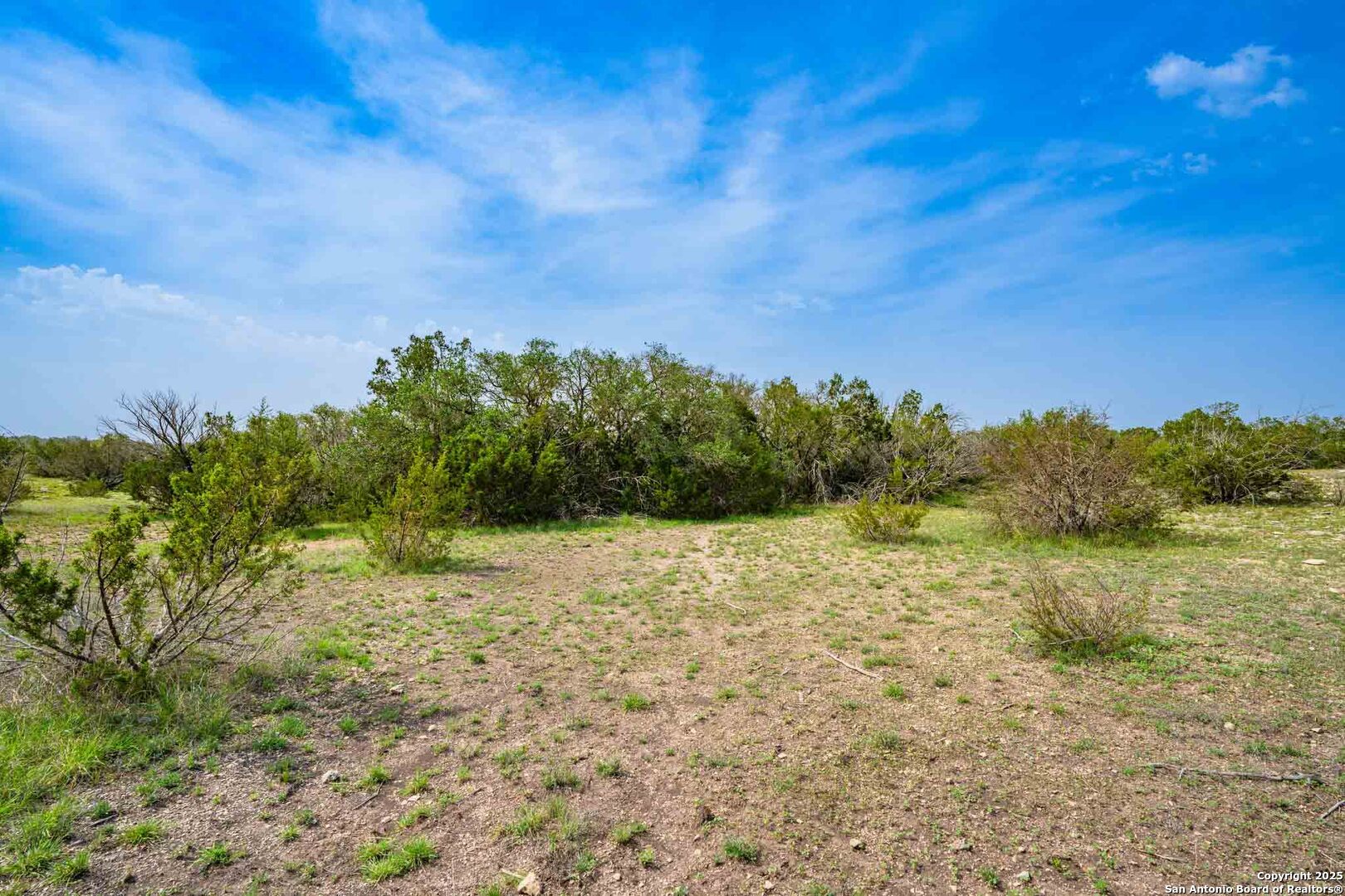 Tbd 74240th Rocksprings, TX 78880 - Photo 16 of 33 a view of a lake with a yard
