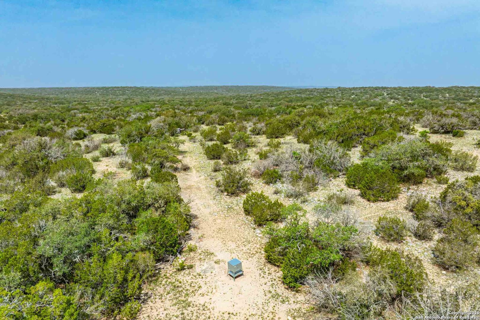 Tbd 74240th Rocksprings, TX 78880 - Photo 9 of 33 an aerial view of residential houses with outdoor space and trees