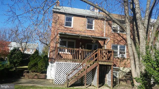 1215 Cedarcroft Road Baltimore, MD 21239 - Photo 11 of 11 a view of house with backyard and trees