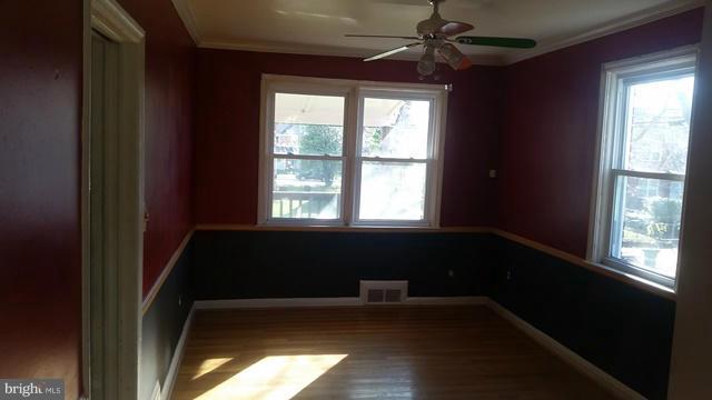 1215 Cedarcroft Road Baltimore, MD 21239 - Photo 6 of 11 a bathroom with a bathtub and a window