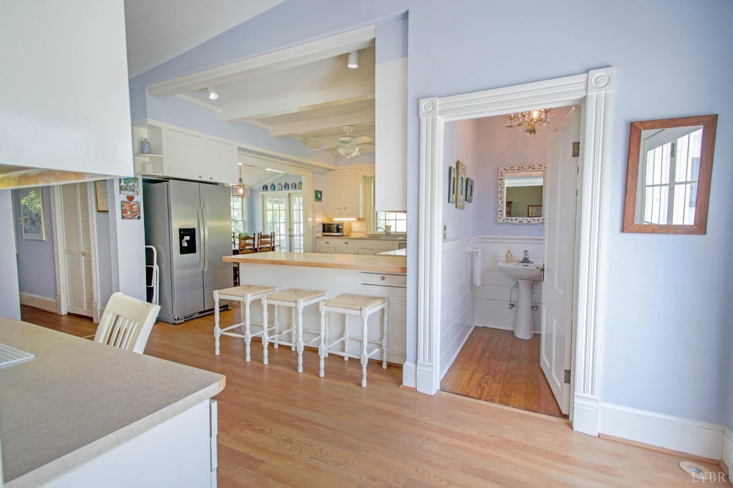 1861 Link Road Lynchburg, VA 24503 - Photo 25 of 99 a living room with stainless steel appliances kitchen island granite countertop wooden floor and a view of kitchen