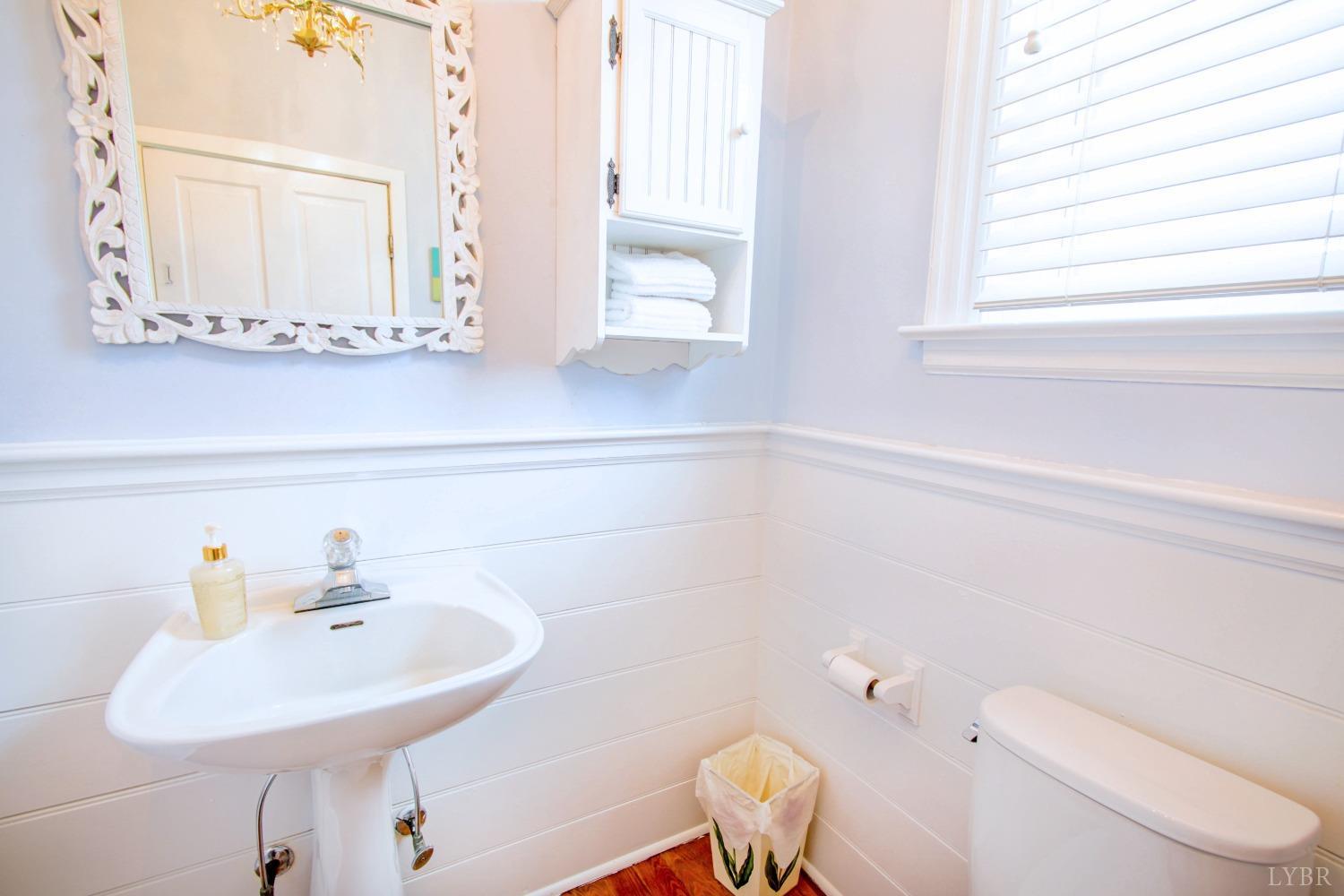 1861 Link Road Lynchburg, VA 24503 - Photo 27 of 99 a bathroom with a sink a toilet and a mirror