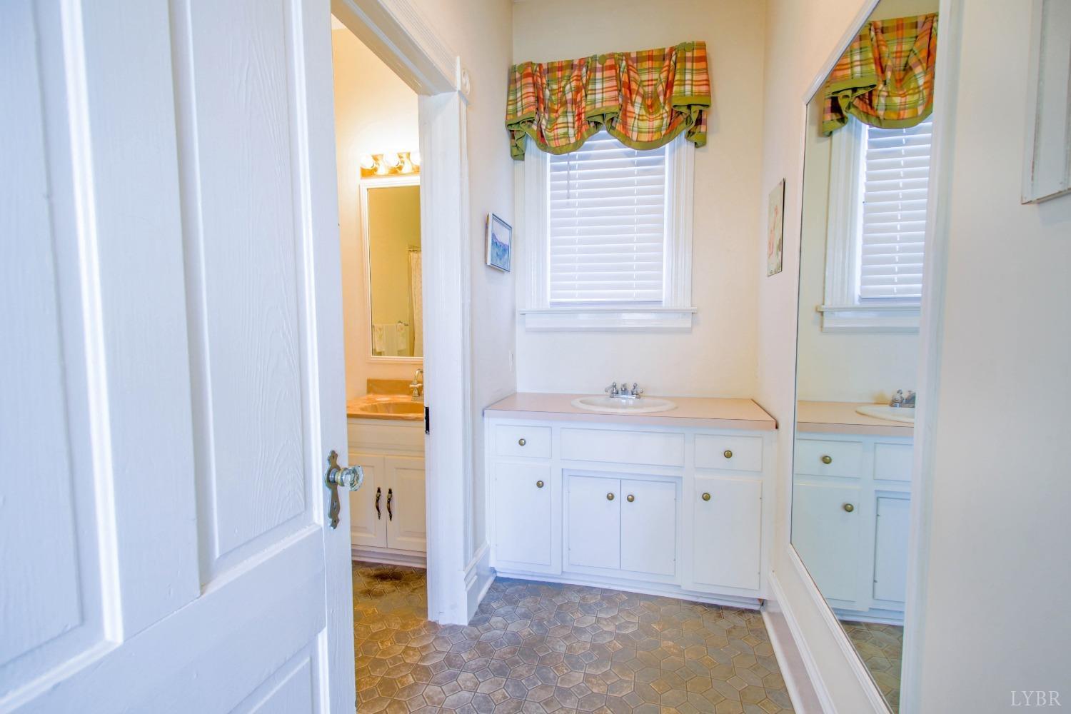 1861 Link Road Lynchburg, VA 24503 - Photo 49 of 99 a bathroom with a sink and a mirror
