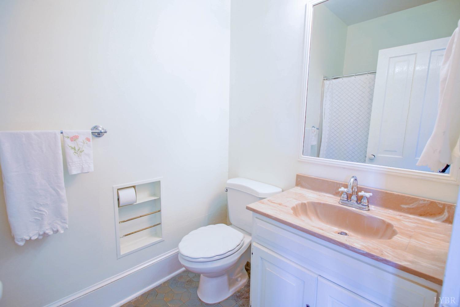 1861 Link Road Lynchburg, VA 24503 - Photo 50 of 99 a bathroom with a granite countertop sink a toilet and a mirror