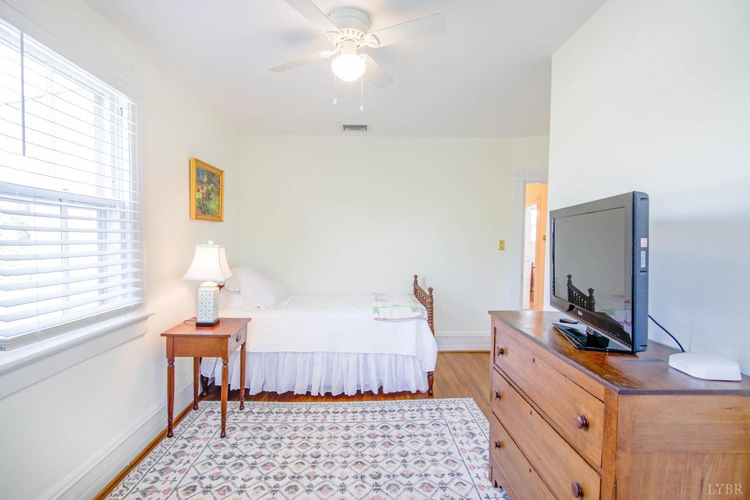 1861 Link Road Lynchburg, VA 24503 - Photo 65 of 99 a room with a bed and a flat screen tv