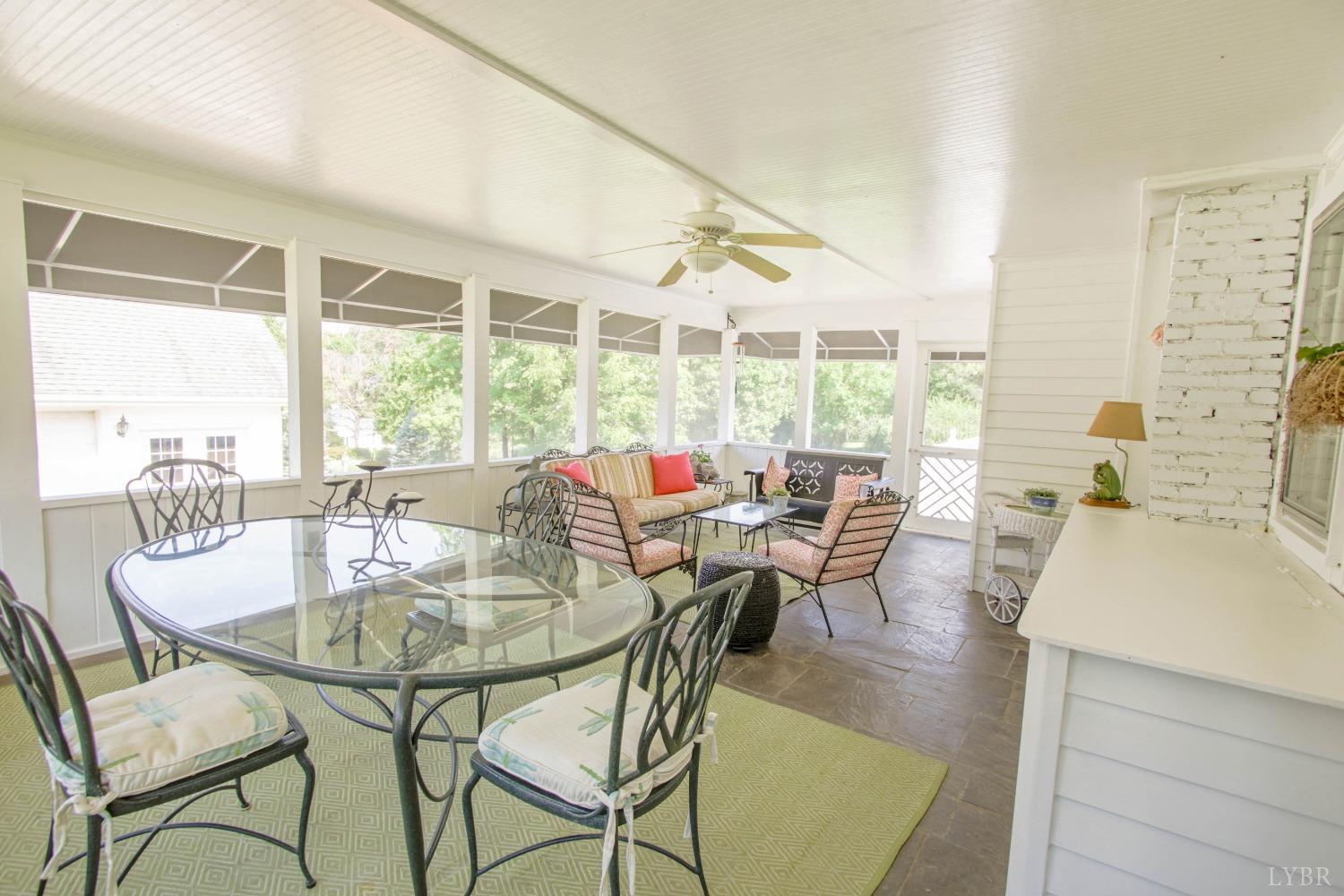 1861 Link Road Lynchburg, VA 24503 - Photo 74 of 99 a dining room with furniture a chandelier and wooden floor