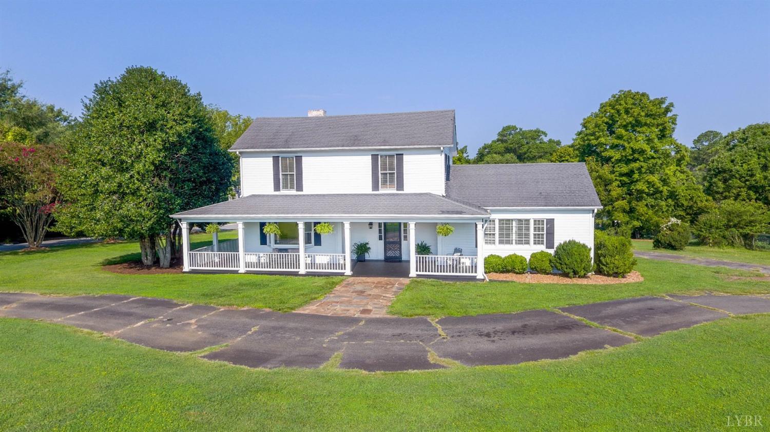 1861 Link Road Lynchburg, VA 24503 - Photo 88 of 99 a front view of a house with a yard and potted plants