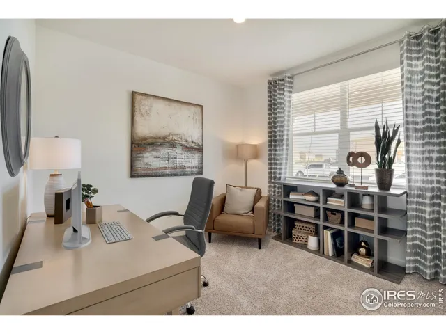 a living room with furniture a large window and a flat screen tv