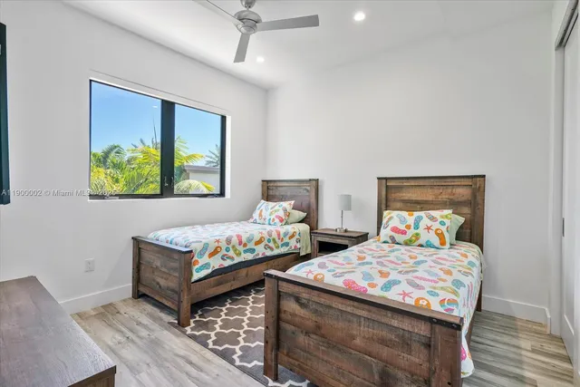 a bathroom with a sink a mirror and shower