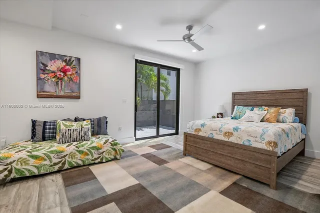 a bathroom with a bathtub shower sink vanity and toilet