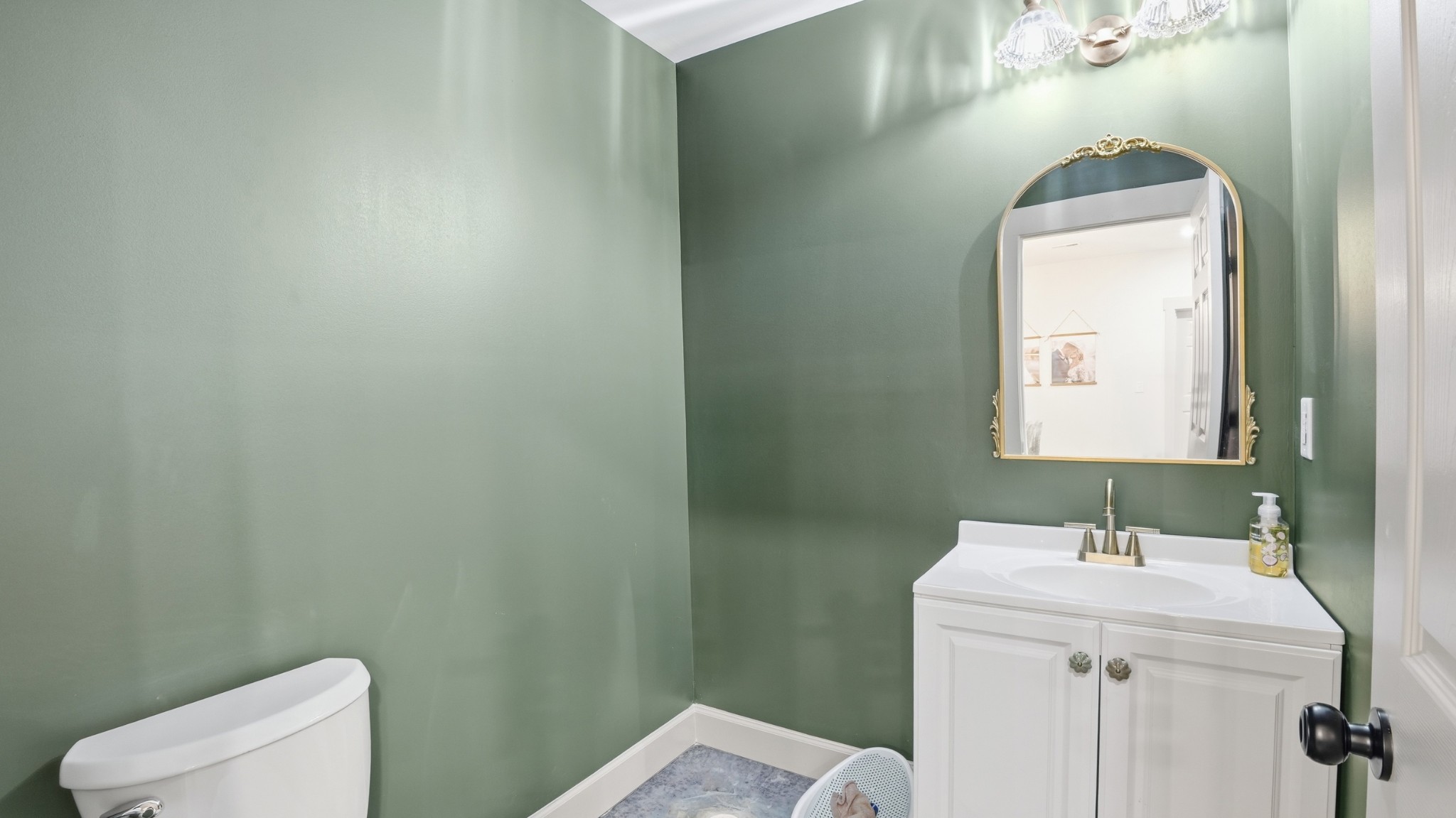 318 Robinson Road Dellrose, TN 38453 - Photo 16 of 56 a bathroom with a toilet a sink a mirror and vanity