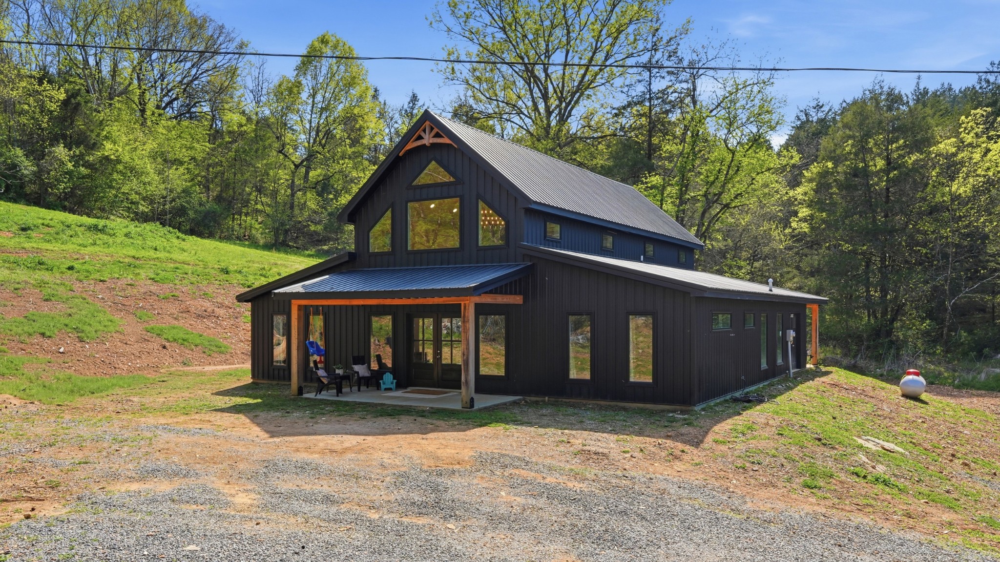 318 Robinson Road Dellrose, TN 38453 - Photo 2 of 56 a front view of a house with a yard and garage