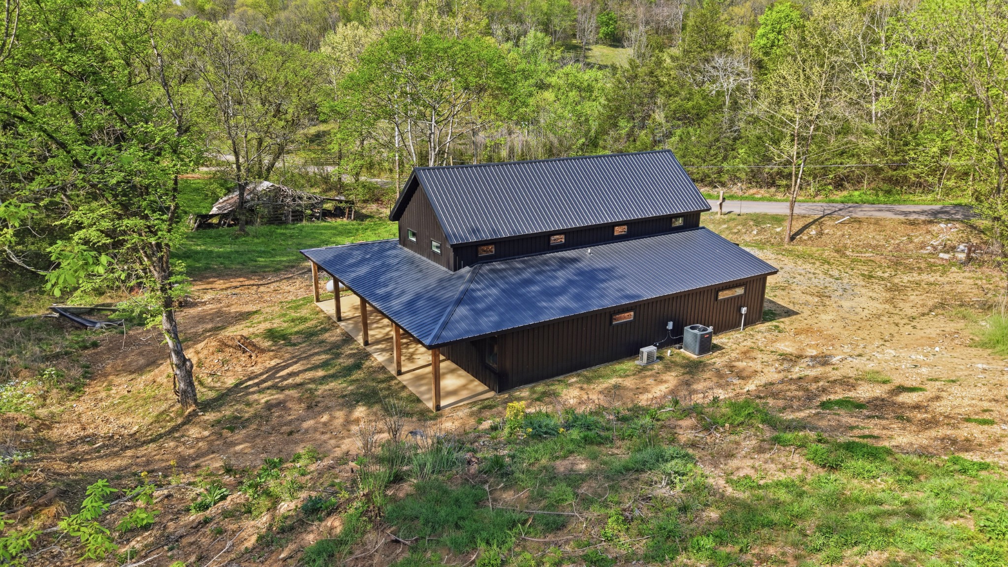 318 Robinson Road Dellrose, TN 38453 - Photo 40 of 56 a wooden bench sitting in the middle of a yard