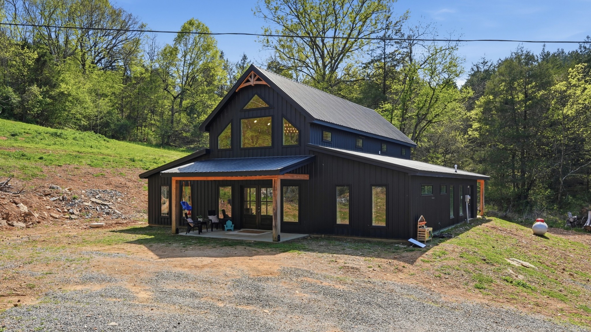 318 Robinson Road Dellrose, TN 38453 - Photo 54 of 56 a front view of a house with a yard and garage