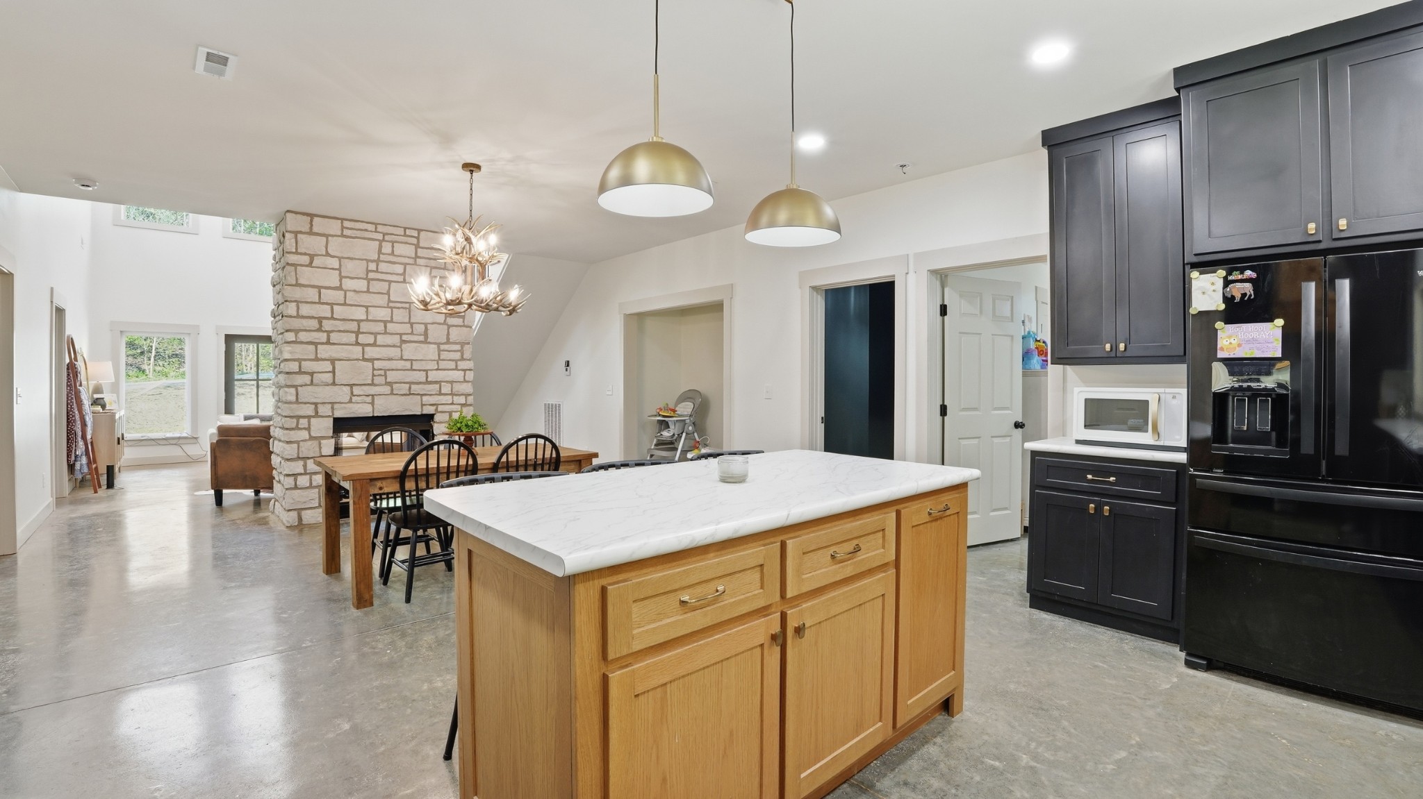 318 Robinson Road Dellrose, TN 38453 - Photo 10 of 56 a kitchen with a table chairs sink and refrigerator